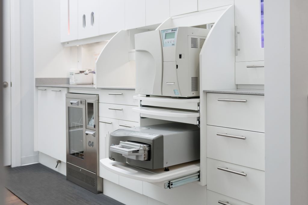 Dental sterilization and autoclave equipment at Calma Dental, showing the clinic's infection control standards